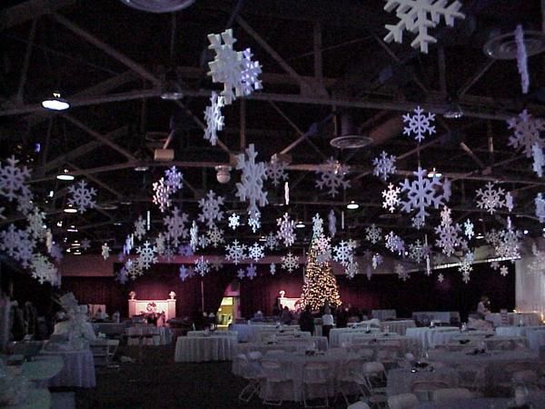 foam snowflakes hanging from the ceiling in a large room